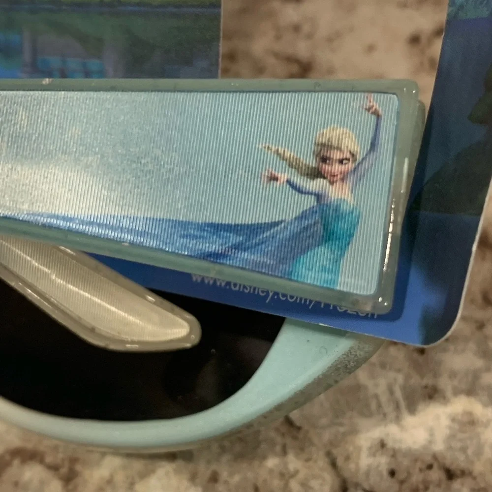 Disney frozen sunglasses, necklace, and stuffed animal lot